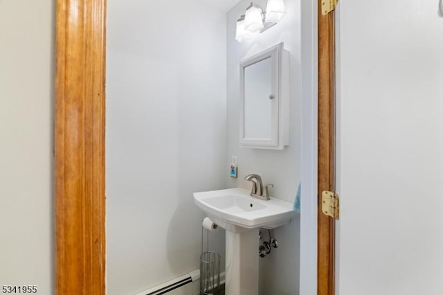 bathroom featuring baseboard heating