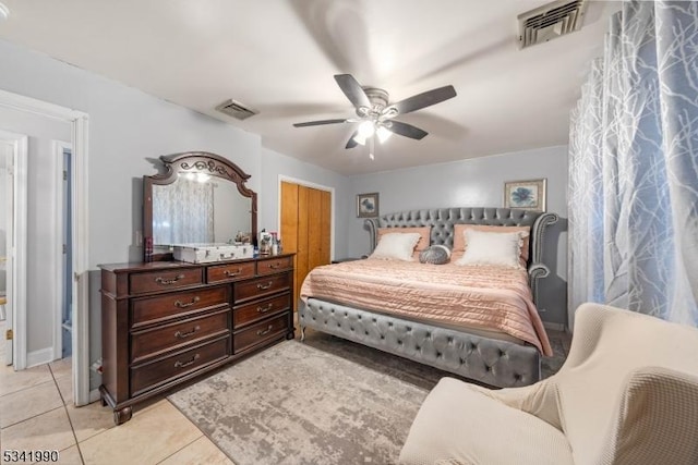 bedroom with light tile patterned floors, ceiling fan, and visible vents