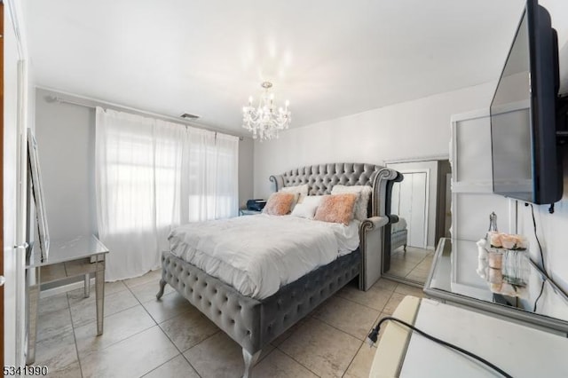 bedroom featuring visible vents, a notable chandelier, and light tile patterned flooring