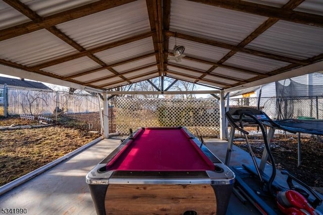 exterior space featuring lofted ceiling, billiards, and metal wall