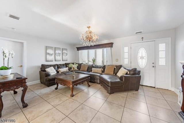 living room with a healthy amount of sunlight, visible vents, a notable chandelier, and light tile patterned floors