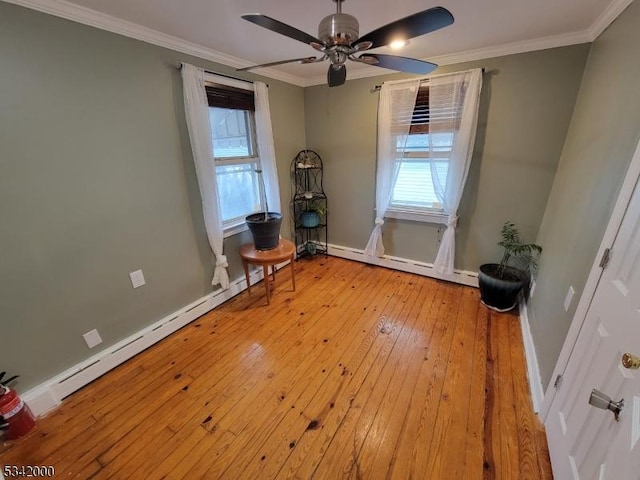 unfurnished bedroom featuring a baseboard radiator, hardwood / wood-style flooring, baseboards, baseboard heating, and crown molding