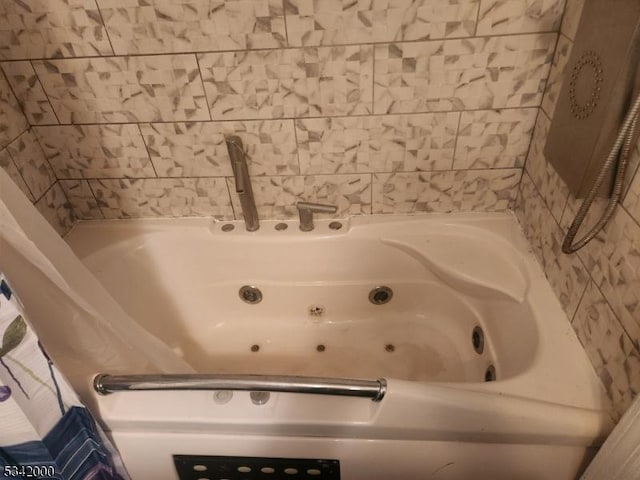 full bath with a jetted tub