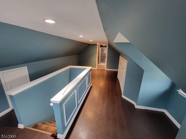 bonus room featuring dark wood-style floors, recessed lighting, vaulted ceiling, and baseboards