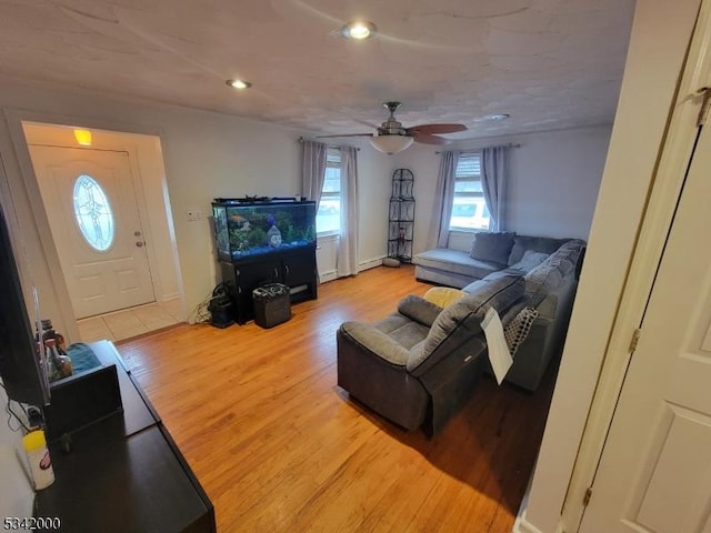 living room featuring a ceiling fan, wood finished floors, and recessed lighting