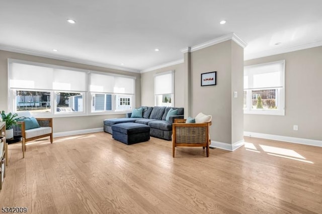 living room with recessed lighting, baseboards, crown molding, and light wood finished floors