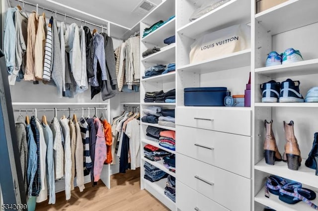 spacious closet with wood finished floors and visible vents