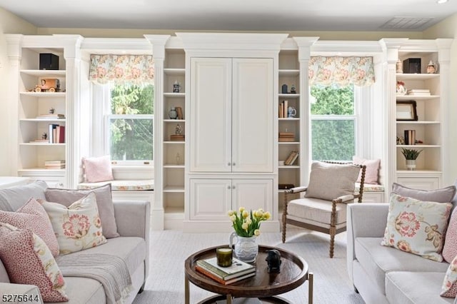 sitting room with a wealth of natural light and visible vents