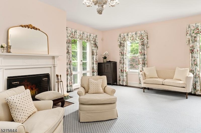 sitting room with carpet floors and a fireplace