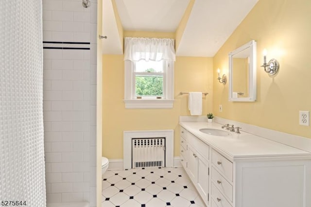 full bath with a shower with shower curtain, vanity, toilet, and radiator