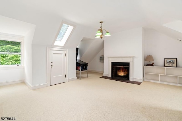 unfurnished living room with a fireplace with flush hearth, vaulted ceiling, carpet floors, and baseboards