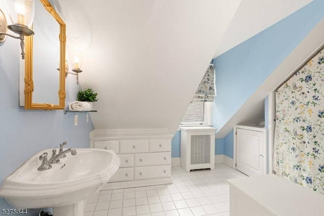 bathroom featuring tile patterned flooring and a sink