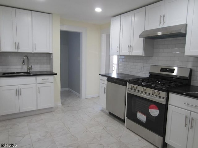 kitchen with marble finish floor, stainless steel appliances, a sink, and under cabinet range hood