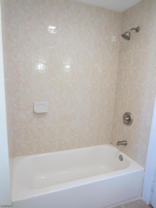 full bath featuring washtub / shower combination