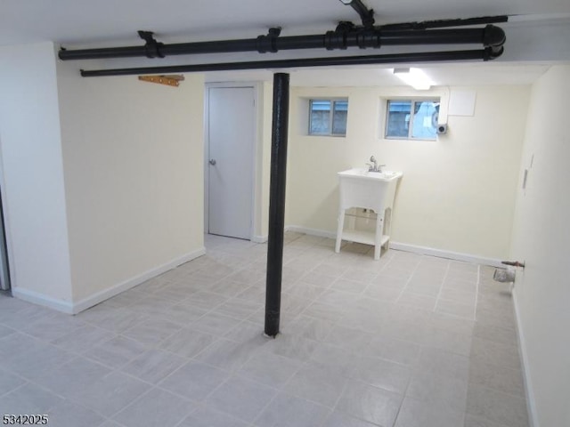 finished basement featuring baseboards