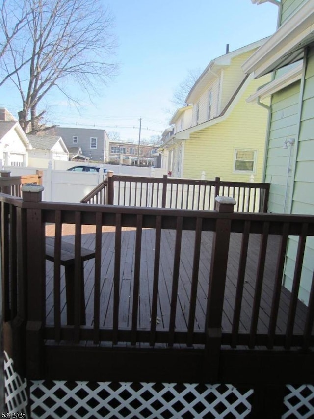 wooden terrace featuring a residential view