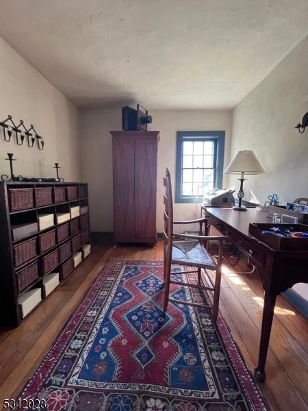 office space with wood finished floors