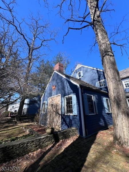 view of side of property featuring a chimney