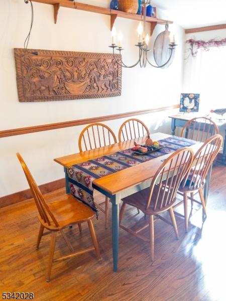 dining area featuring baseboards and wood finished floors