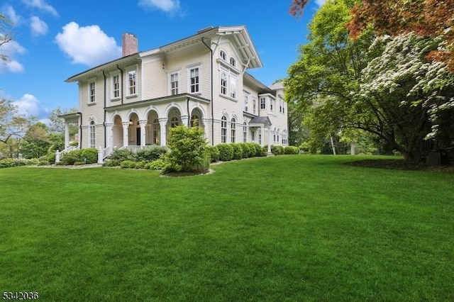 29 Kitchell Rd, Morris Twp, NJ 07960 - view of front facade with a chimney and a front lawn
