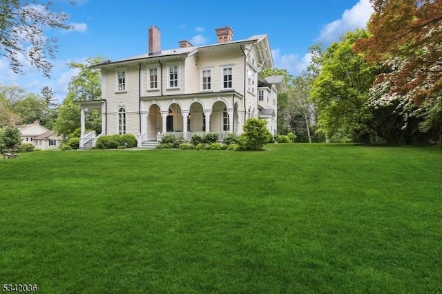 29 Kitchell Rd, Morris Twp, NJ 07960 - italianate house with a chimney, a front yard, and a porch