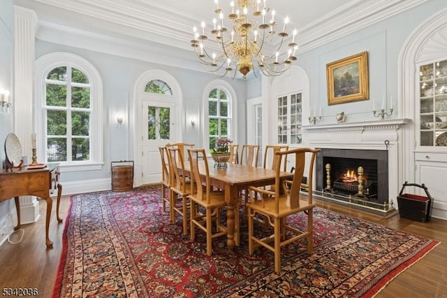 29 Kitchell Rd, Morris Twp, NJ 07960 - dining area featuring wood finished floors, crown molding, a lit fireplace, and a chandelier
