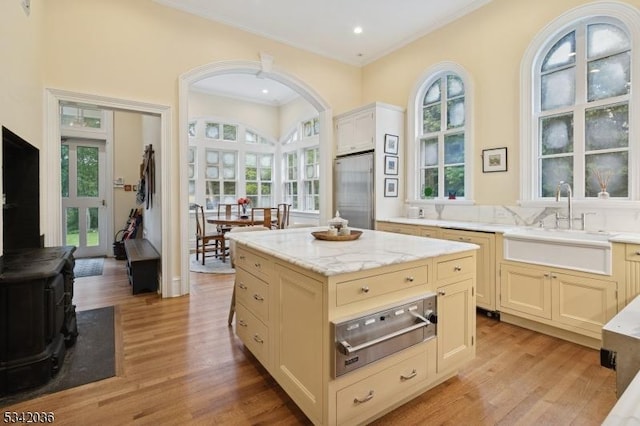 29 Kitchell Rd, Morris Twp, NJ 07960 - kitchen with a warming drawer, stainless steel built in refrigerator, light wood-style flooring, ornamental molding, and light stone countertops