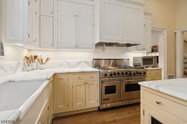 29 Kitchell Rd, Morris Twp, NJ 07960 - kitchen with range with two ovens, wood finished floors, light stone countertops, and white cabinets