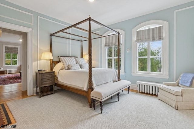 29 Kitchell Rd, Morris Twp, NJ 07960 - bedroom featuring radiator heating unit and wood finished floors