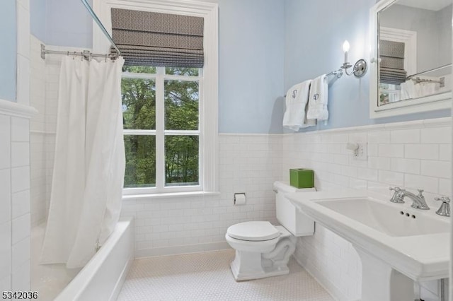 29 Kitchell Rd, Morris Twp, NJ 07960 - bathroom featuring tile walls, tile patterned floors, shower / tub combo with curtain, and a wainscoted wall