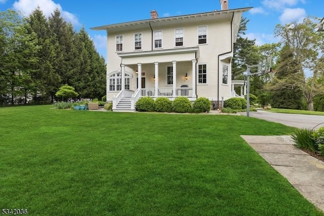 29 Kitchell Rd, Morris Twp, NJ 07960 - view of front of property with a chimney, covered porch, and a front lawn