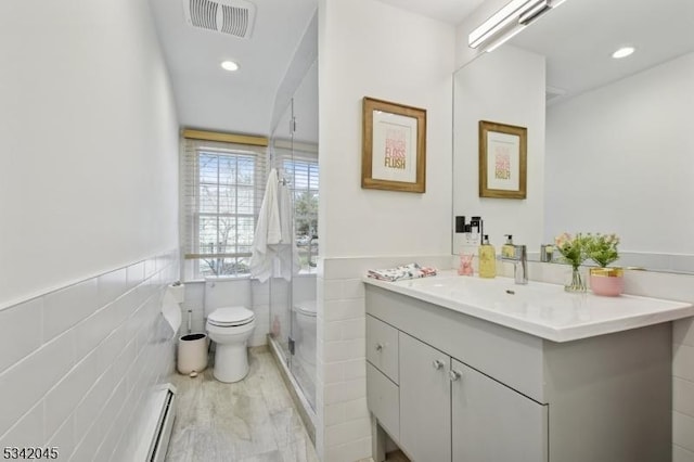 bathroom featuring a wainscoted wall, vanity, toilet, and recessed lighting