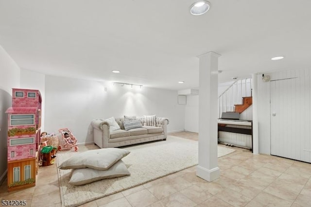 living area with baseboards, stairway, and recessed lighting