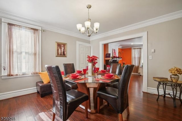 dining room featuring ornamental molding, a notable chandelier, dark wood finished floors, and baseboards