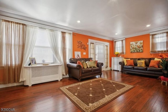 living room with recessed lighting, crown molding, and hardwood / wood-style flooring