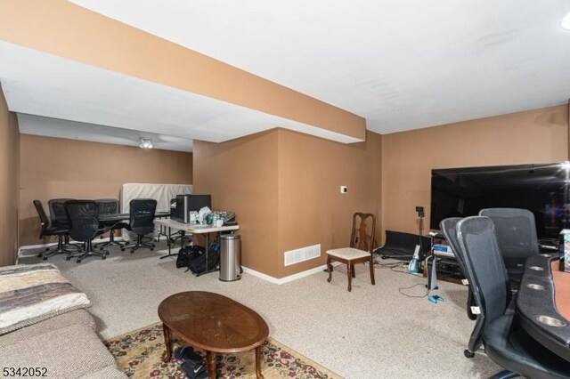 carpeted home office with visible vents and baseboards