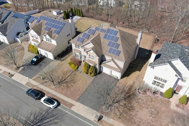 birds eye view of property with a residential view