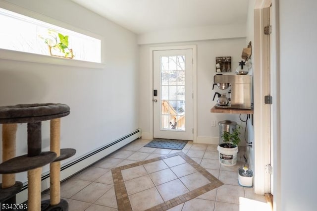 doorway featuring light tile patterned flooring, a baseboard heating unit, and baseboards