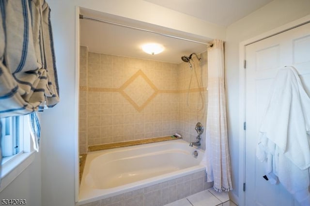 full bathroom with tile patterned flooring and tiled shower / bath combo