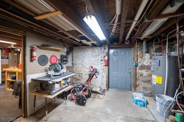 unfinished basement featuring water heater