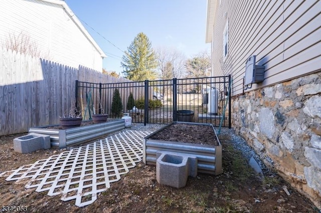 view of yard with a garden and fence