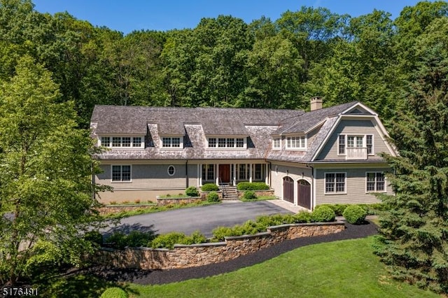 91 Overleigh Rd, Bernardsville Boro, NJ 07924 - shingle-style home featuring asphalt driveway, a gambrel roof, a forest view, and a chimney