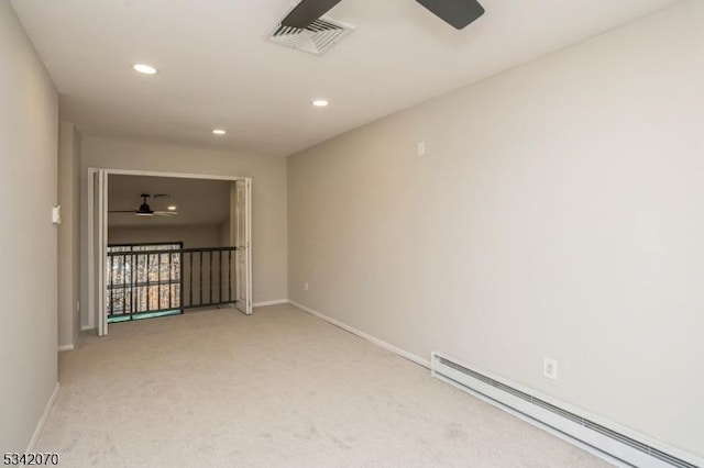 spare room with visible vents, light colored carpet, baseboard heating, recessed lighting, and a ceiling fan