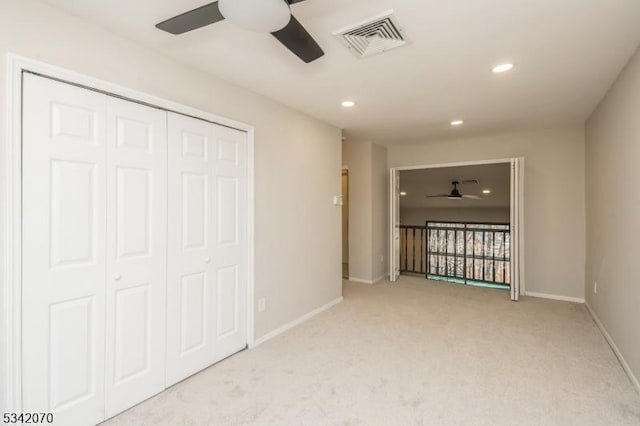 interior space with visible vents, light carpet, recessed lighting, a closet, and baseboards