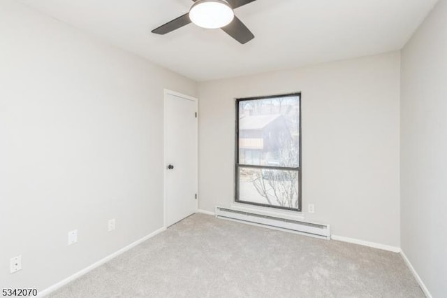 carpeted empty room with baseboards, baseboard heating, and ceiling fan