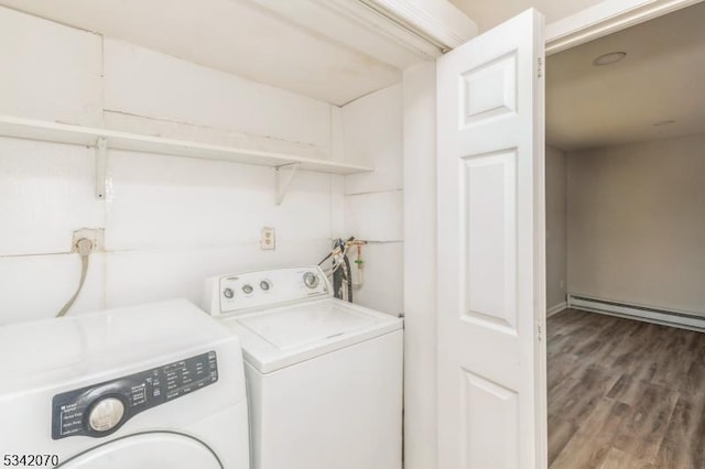 laundry room with laundry area, independent washer and dryer, wood finished floors, and a baseboard radiator