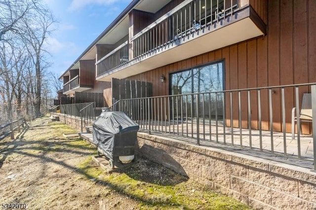 view of side of property featuring fence