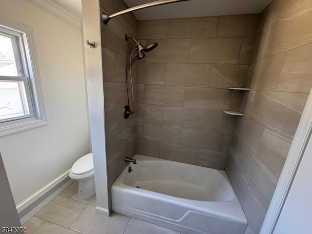 bathroom with shower / bathing tub combination, baseboards, and toilet