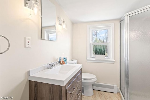 full bathroom with toilet, baseboard heating, a stall shower, wood finished floors, and vanity