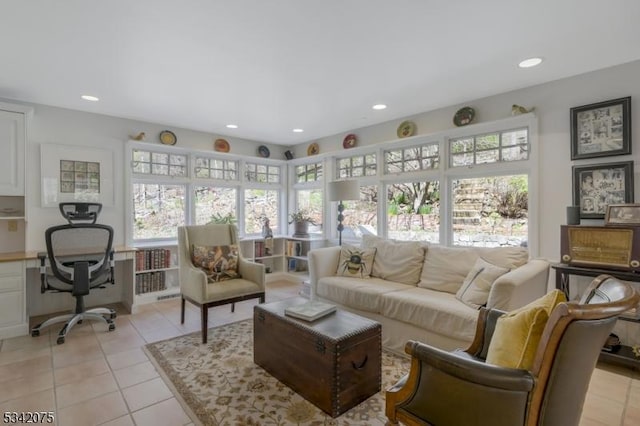 living room featuring light tile patterned floors, recessed lighting, and plenty of natural light